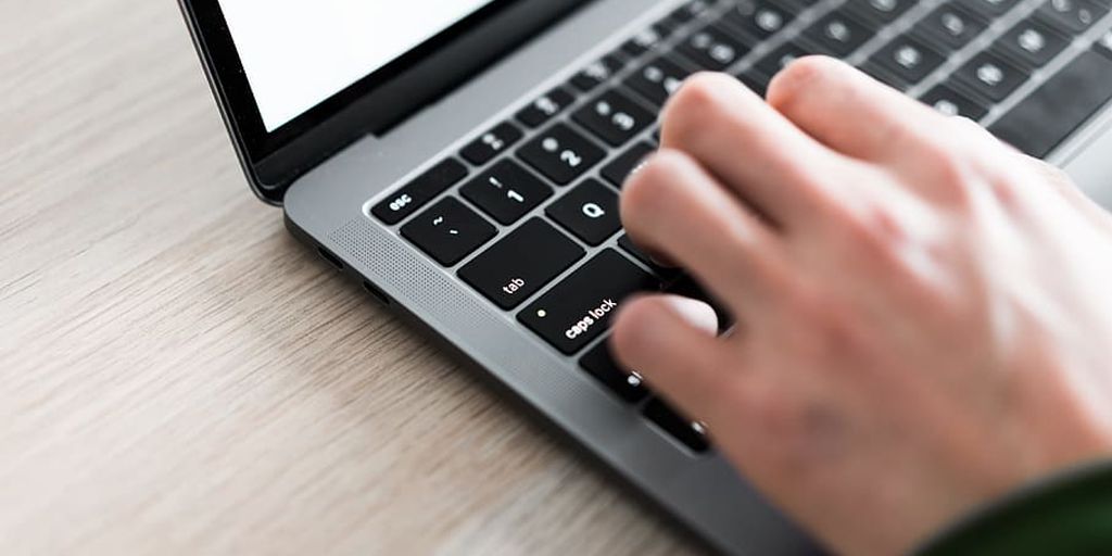 freelancer working on laptop in a cozy home office